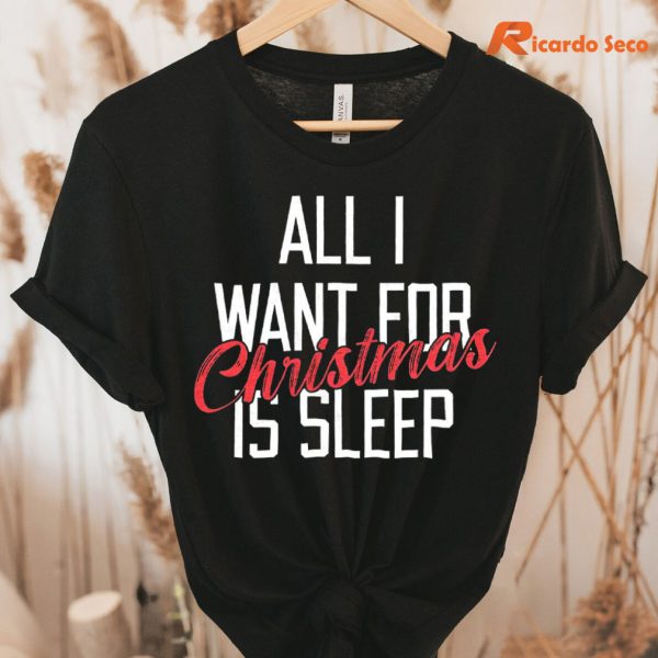 All I Want for Christmas Is Sleep T-Shirt hung on a hanger