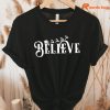 Believe Christmas T-shirt hung on a hanger