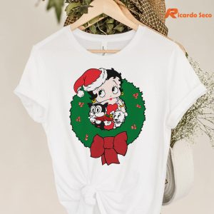 Betty Boop Christmas Characters Wreath T-shirt hanging on a hanger