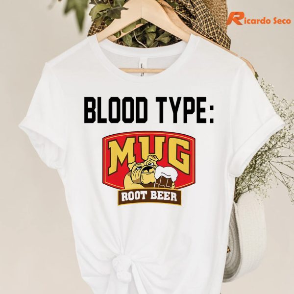 Blood type Mug root beer T-shirt hanging on a hanger