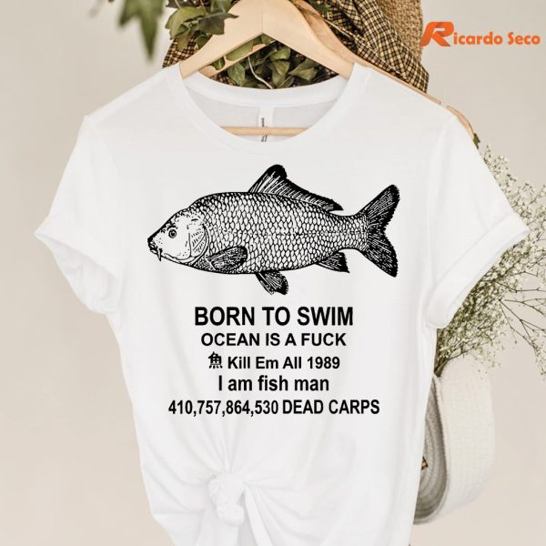 Born to swim ocean is a fuck I am fish man T-shirt hanging on a hanger