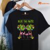 Deck the Palms Merry Flamingo Christmas T-shirt hanging on a hanger