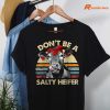Don't Be A Salty Heifer T-shirt hung on a hanger