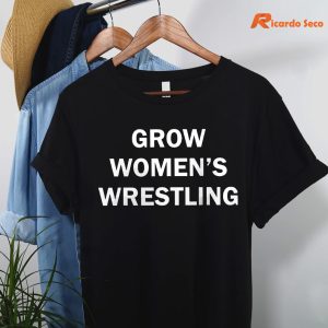 Grow Women's Wrestling T-shirt is hanging on the hanger