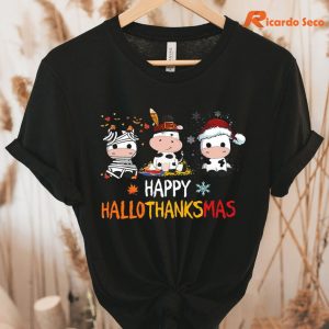 Happy Hallothanksmas Cow Christmas T-shirt hanging on the hanger