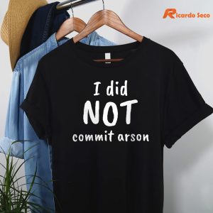 I Did NOT Commit Arson T-shirt hanging on the hanger