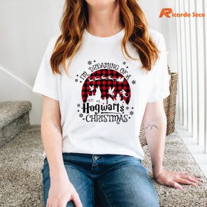 I Dreaming Of A Hogwarts Christmas T-shirt is being worn on the body