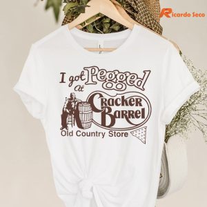 I Got Pegged At Cracker Barrel Old Country Store T-shirt hanging on the hanger