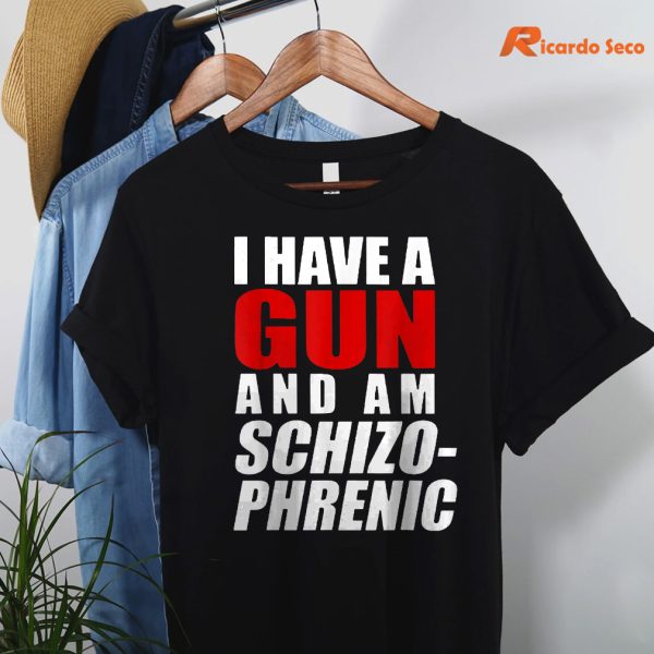 I Have A Gun And Am Schizophrenic Funny Gun T-shirt hanging on the hanger