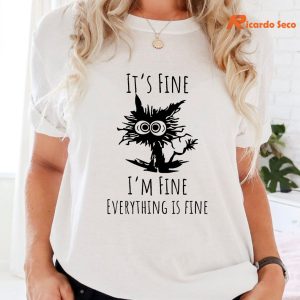 Its Fine I'm Fine Everything is Fine Christmas Cat T-shirt is being worn on the body
