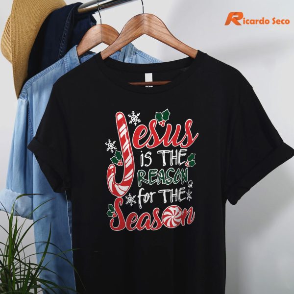 Jesus Is The Reason For The Season Christmas Shirt hanging on a hanger