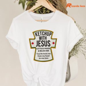 Ketchup With Jesus T-shirt hanging on a hanger