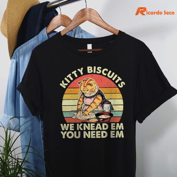 Kitty Biscuits We Knead Em, You Need Em T-shirt hanging on the hanger