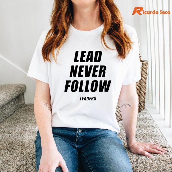 Lead Never Follow Leaders T-shirt is being worn on the body
