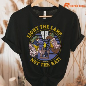 Light The Lamp, Not The Rat The Muppet Christmas Carol T-shirt hung on a hanger