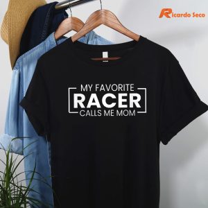 My Favorite Racer Calls Me Mom T-shirt hanging on a hanger