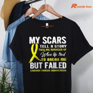 My Scars Tell A Story Endometriosis Awareness T-shirt hanging on a hanger