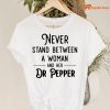 Never Stand Between A Woman And Her Dr Pepper T-shirt hanging on the hanger