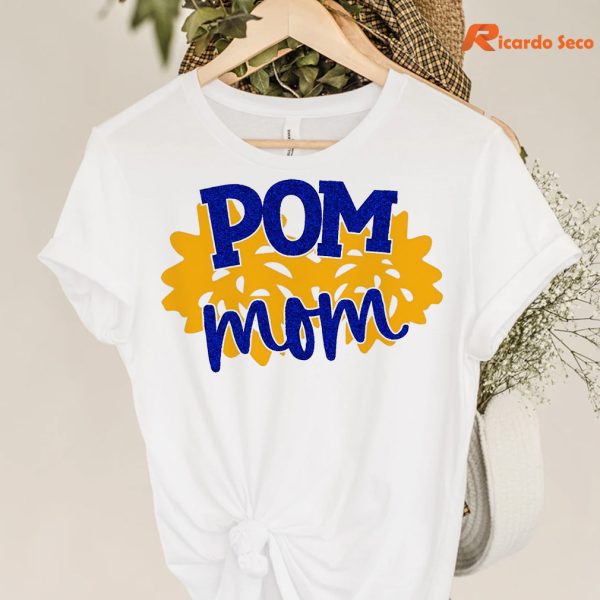 Pom Mom T-shirt hanging on a hanger