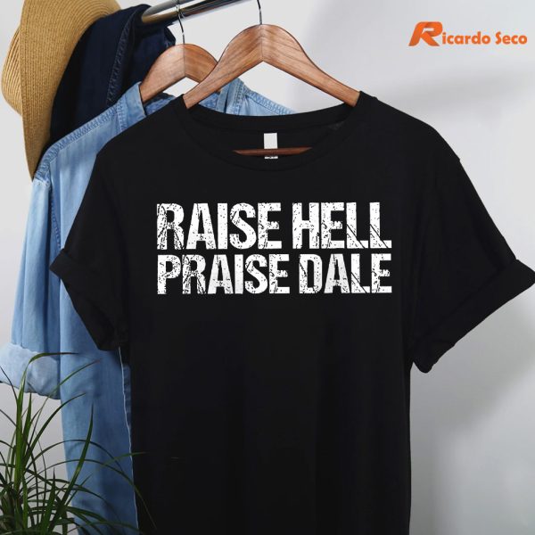 Raise Hell Praise Dale T-shirt hanging on the hanger