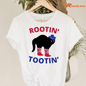 Rootin Tootin Cowboy Black Cat T-shirt hanging on the hanger