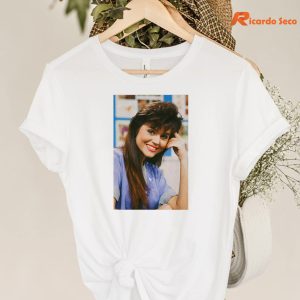 Saved By the Bell Kelly Kapowski T-shirt hanging on a hanger