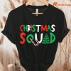 Squad Family Group Matching Shirts Funny Santa Elf Christmas T-Shirt hung on a hanger