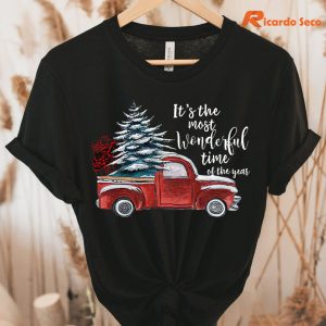 The Most Wonderful Time Christmas Truck T-shirt hanging on a hanger