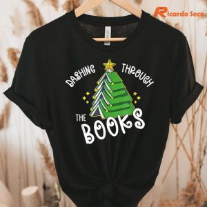 Book Lover Christmas Tree T-shirt hung on a hanger