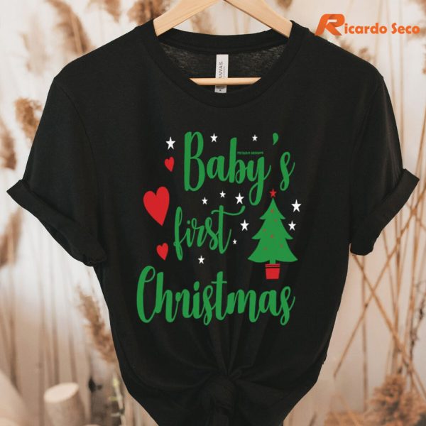 Celebrate Baby's First Christmas T-shirt hung on a hanger