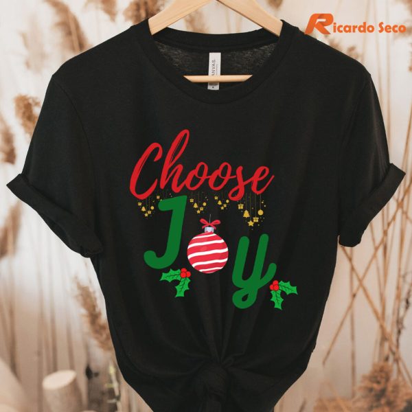 Choose Joy Christmas T-Shirt hung on a hanger