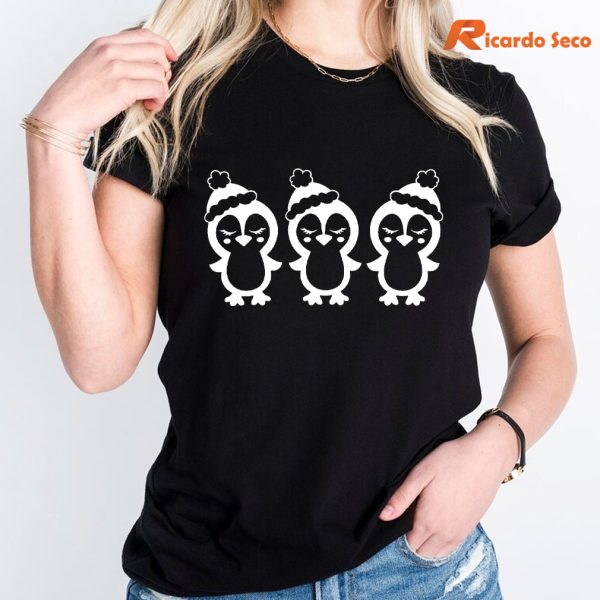 Cute Penguin Christmas T-shirt is worn on the human body