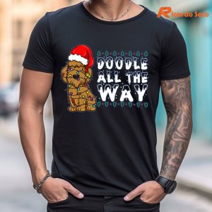 Doodle All The Way Goldendoodle Santa Hat Christmas T-Shirt is worn on the human body