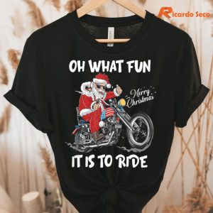Oh What Fun It Is To Ride Motorcycle Christmas T-shirt hung on a hanger